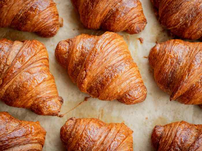 Croissants on a bakery tray